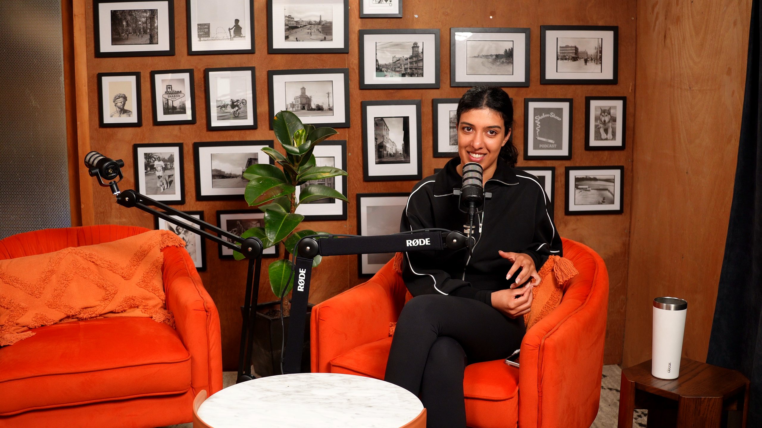 Shaboo in her orange velvet chair in the studio